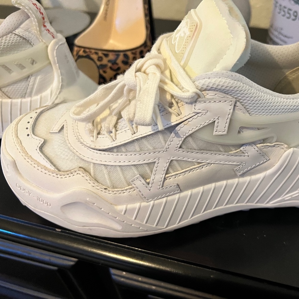 Woman’s off white shoes